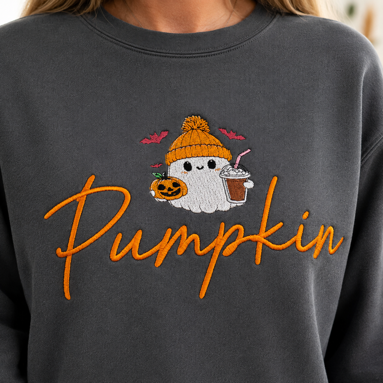 Close-up of ghost, jack-o-lantern and orange Pumpkin script embroidery on Pepper sweatshirt