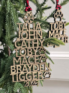Wooden Christmas ornaments with names on a green tree