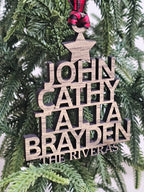 Wooden ornament with engraved names on a Christmas tree