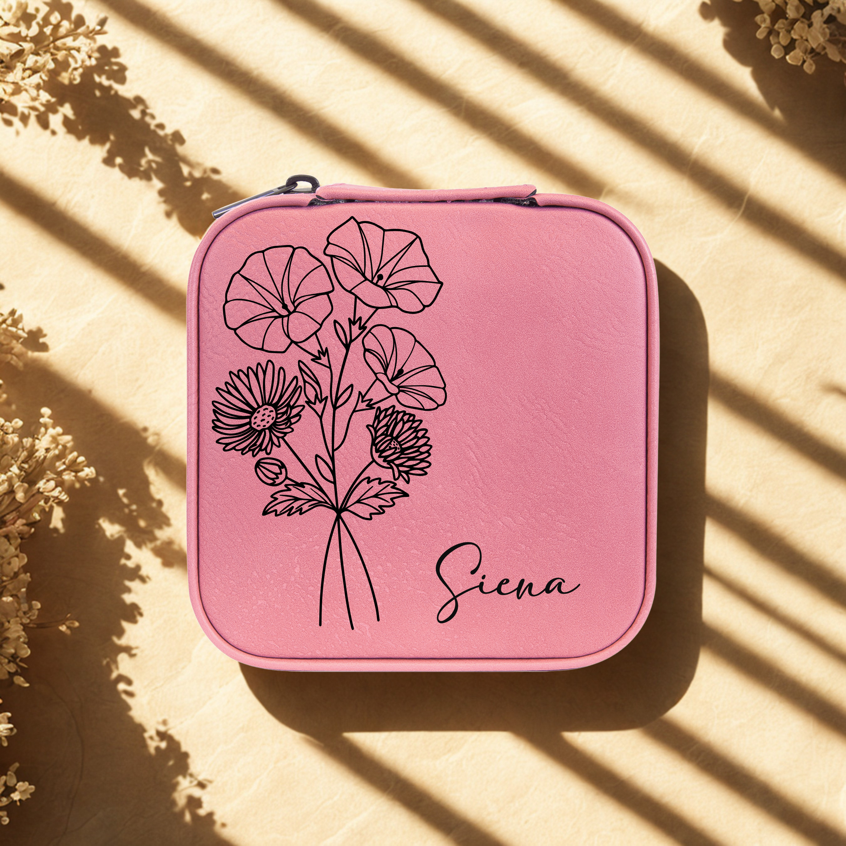 Pink personalized travel jewelry case with birth flower design and name