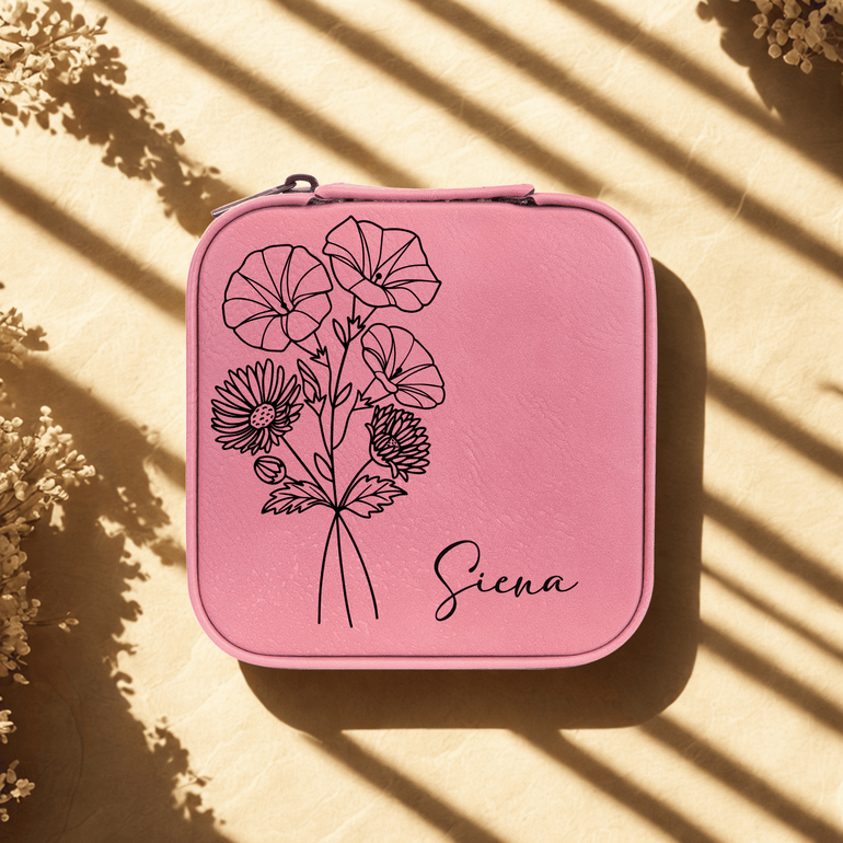 Pink personalized travel jewelry case with birth flower design and name