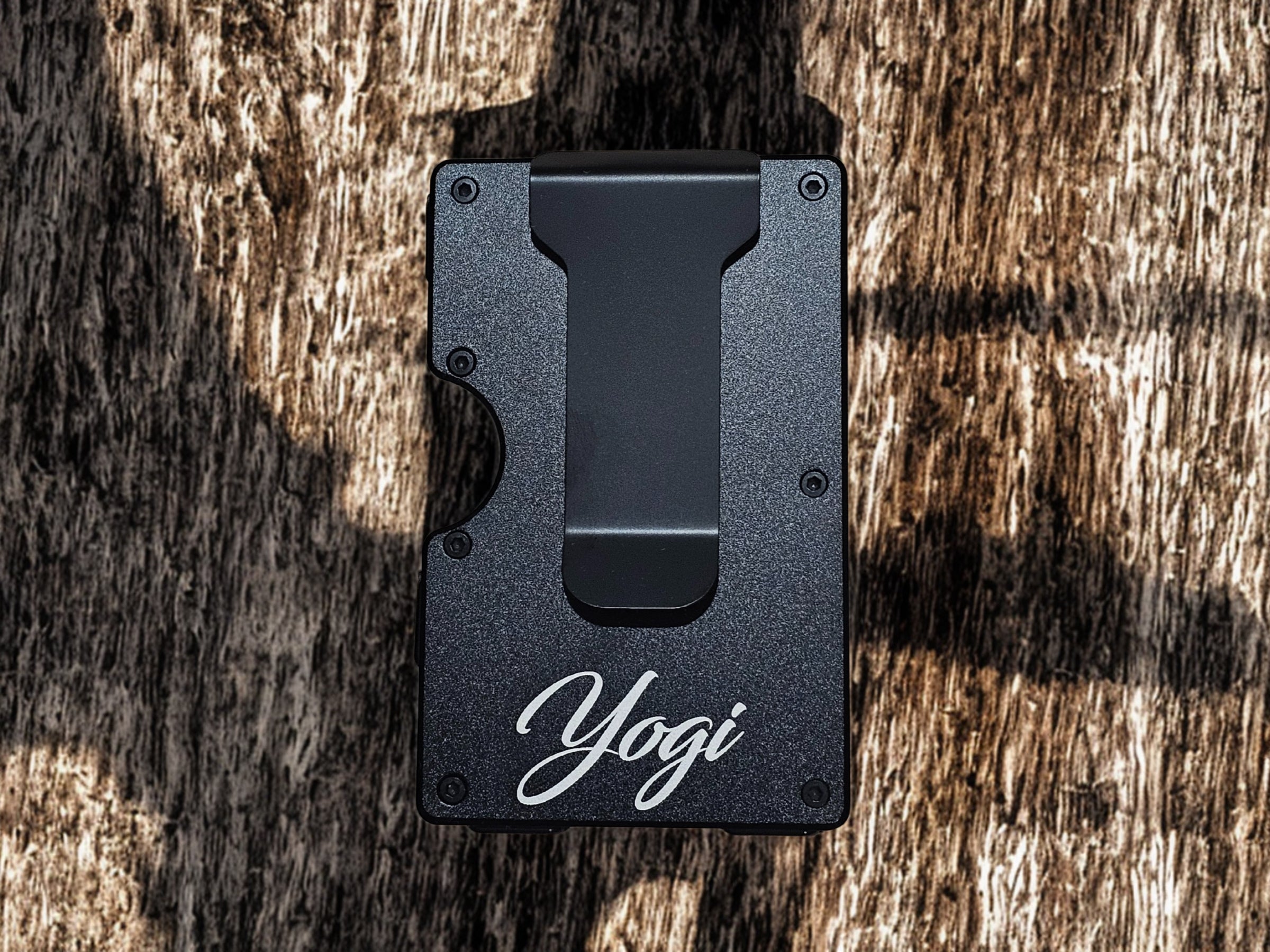 Back side of black lineman wallet showing personalized name engraving on the money clip