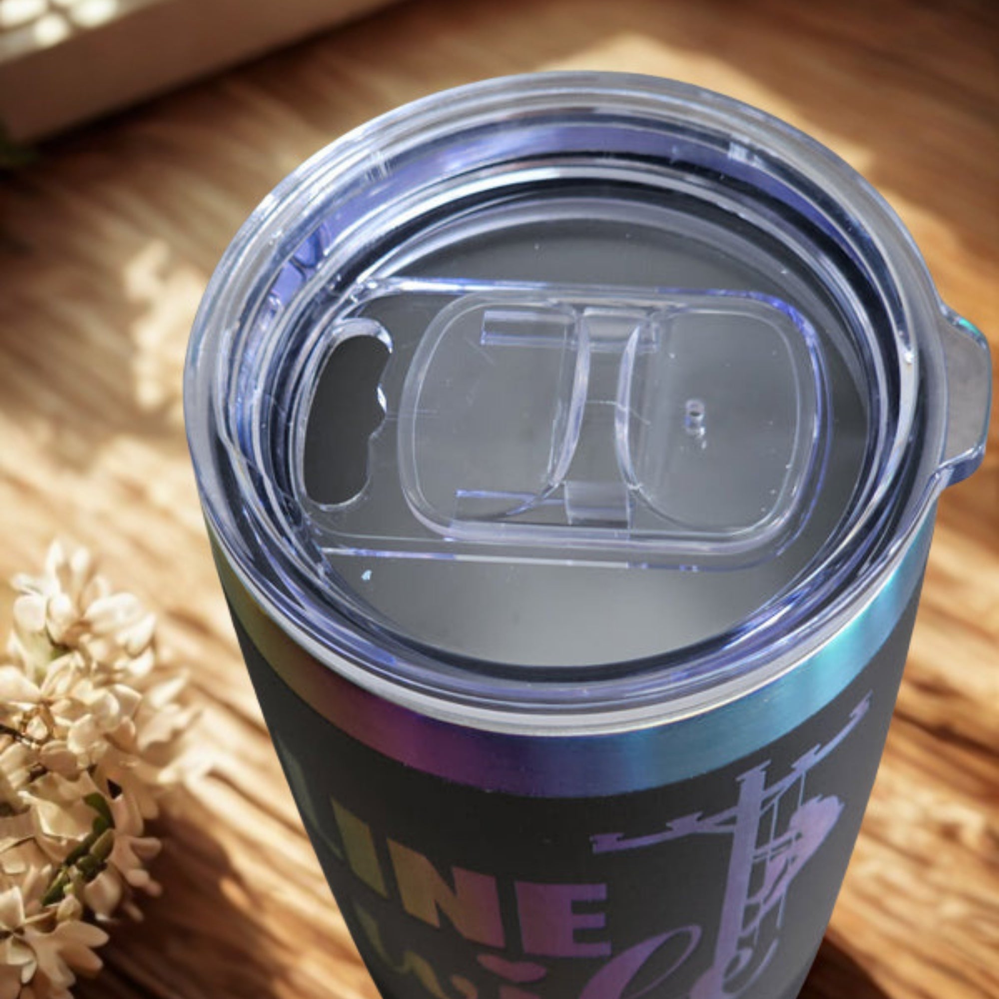 Top view of black Linewife insulated tumbler with clear slip-on lid
