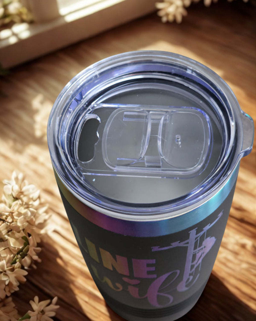 Top view of black Linewife insulated tumbler with clear slip-on lid