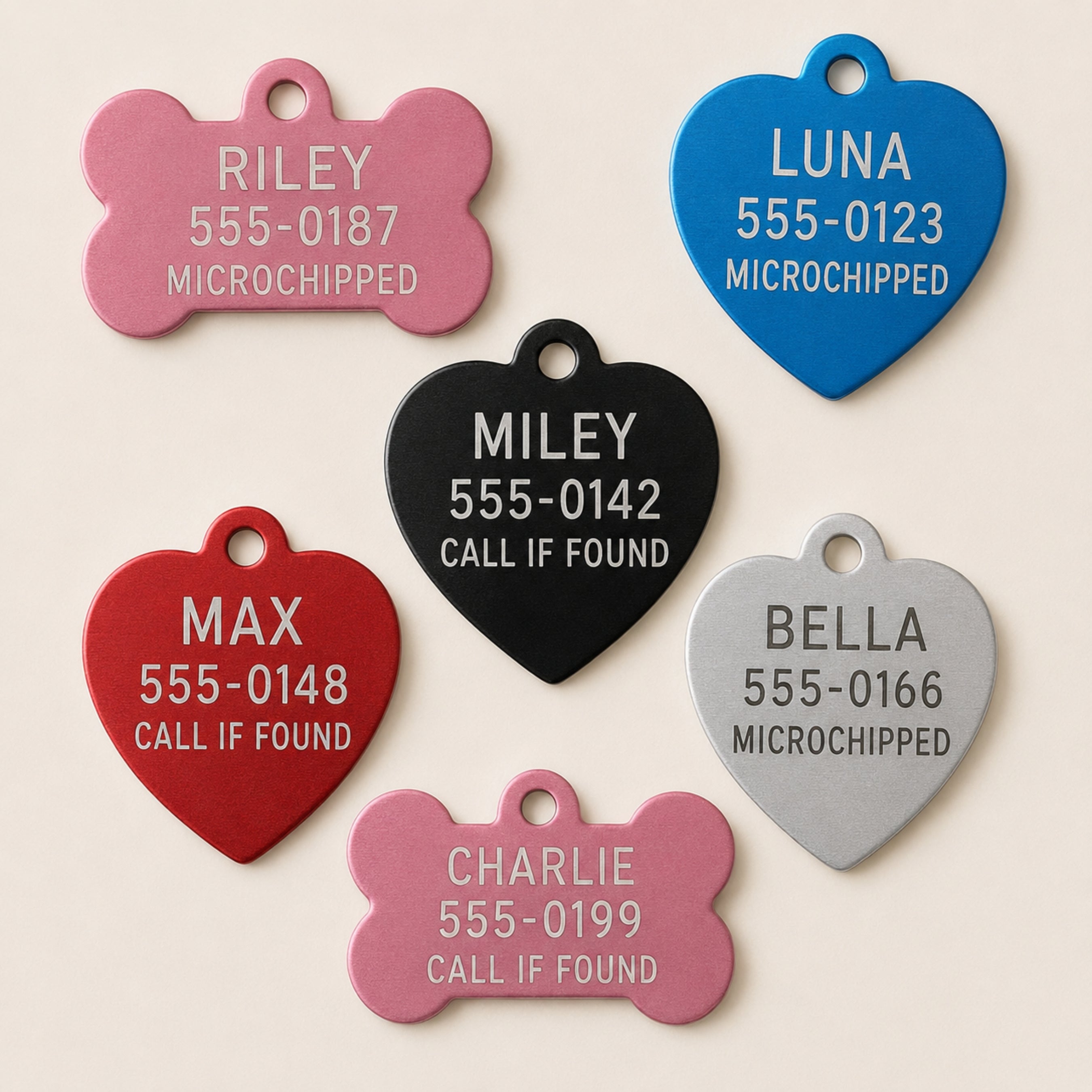 Back side of custom pet ID tags with engraved phone numbers and pet safety details