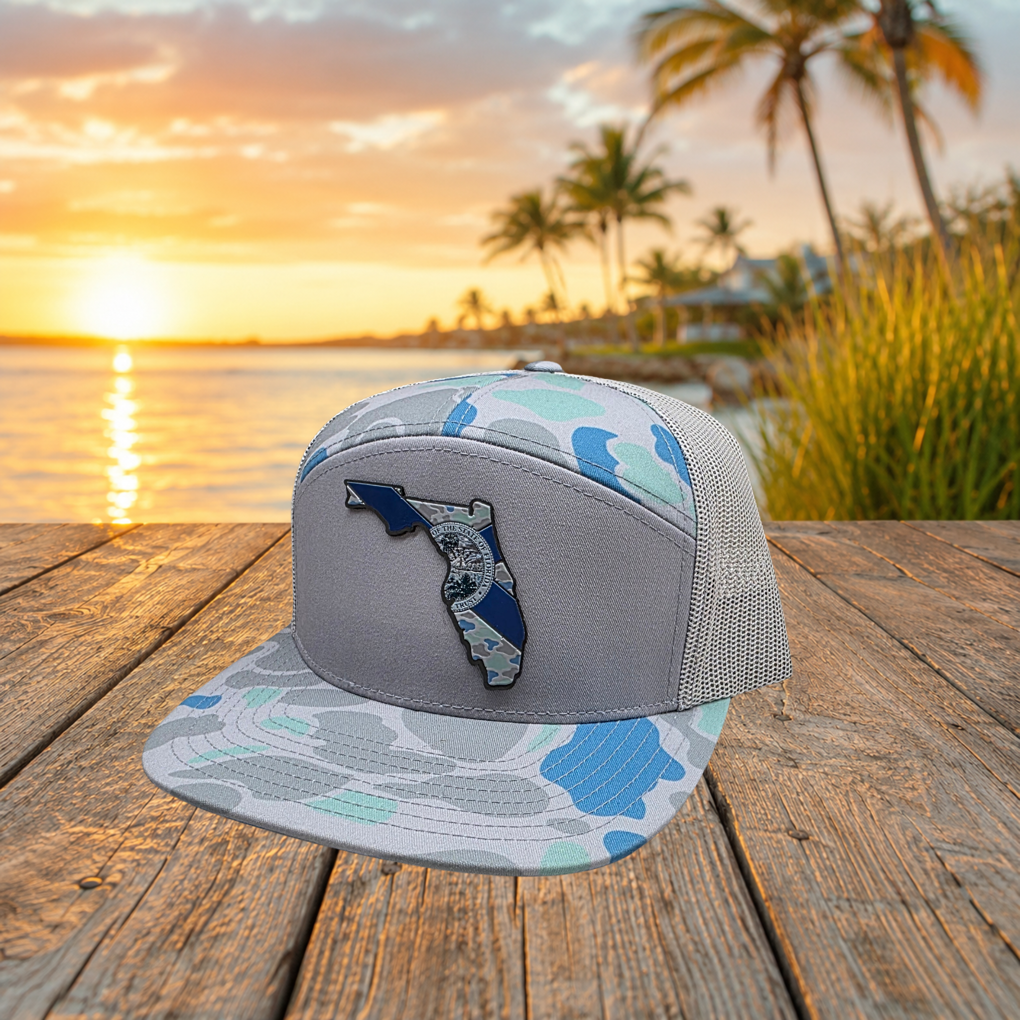Angled view of saltwater blue camo Florida UV printed patch Richardson flat bill trucker hat