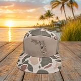 Sand camo Florida UV printed patch Richardson 168P flat bill trucker hat on waterfront dock