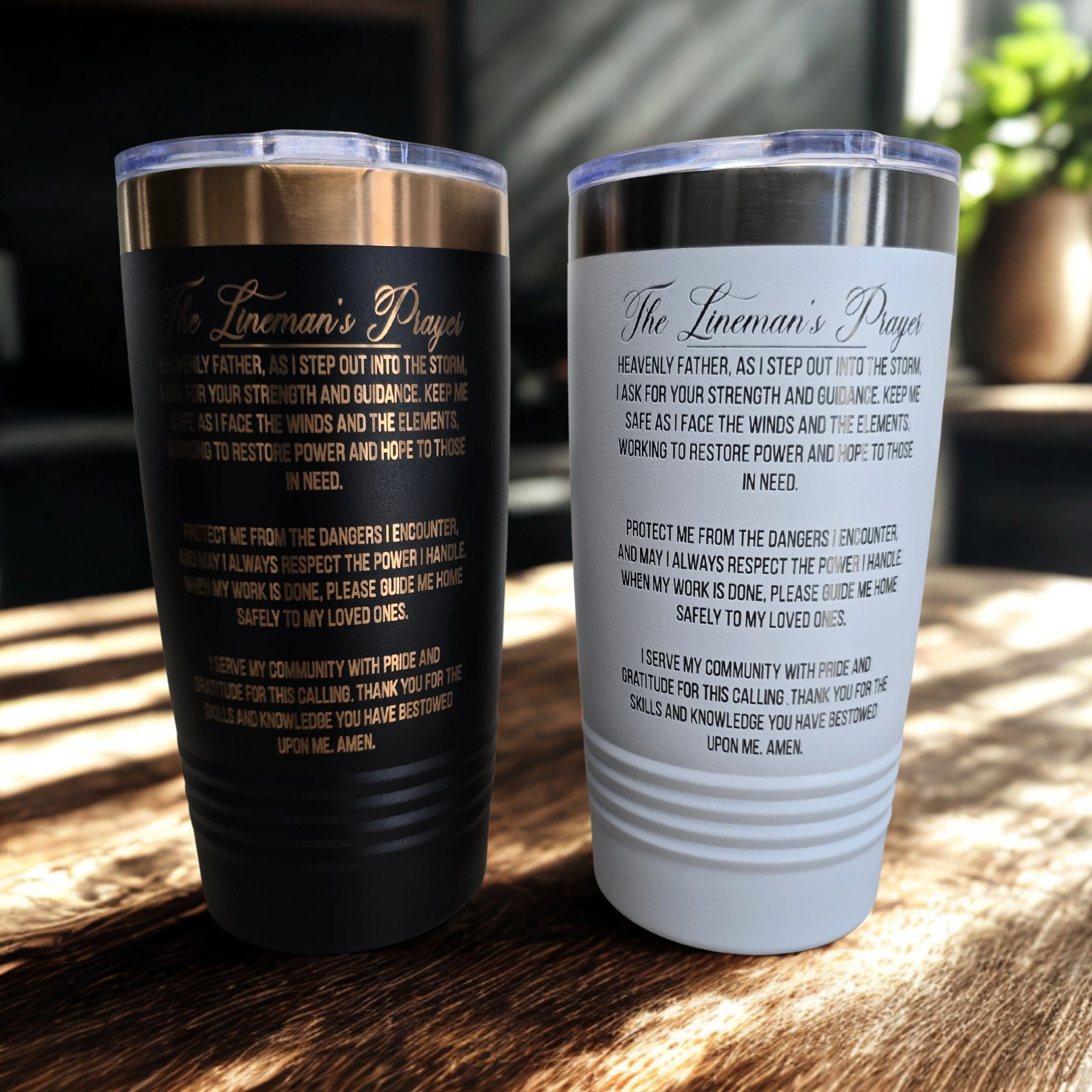 Back side of black and white Lineman’s Prayer tumblers showing engraved prayer text