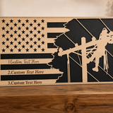 Personalized lineman flag plaque with custom text, wood and black design, displayed on a warm shelf