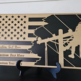 Personalized lineman flag plaque with custom text, wood and black design, displayed on a warm shelf