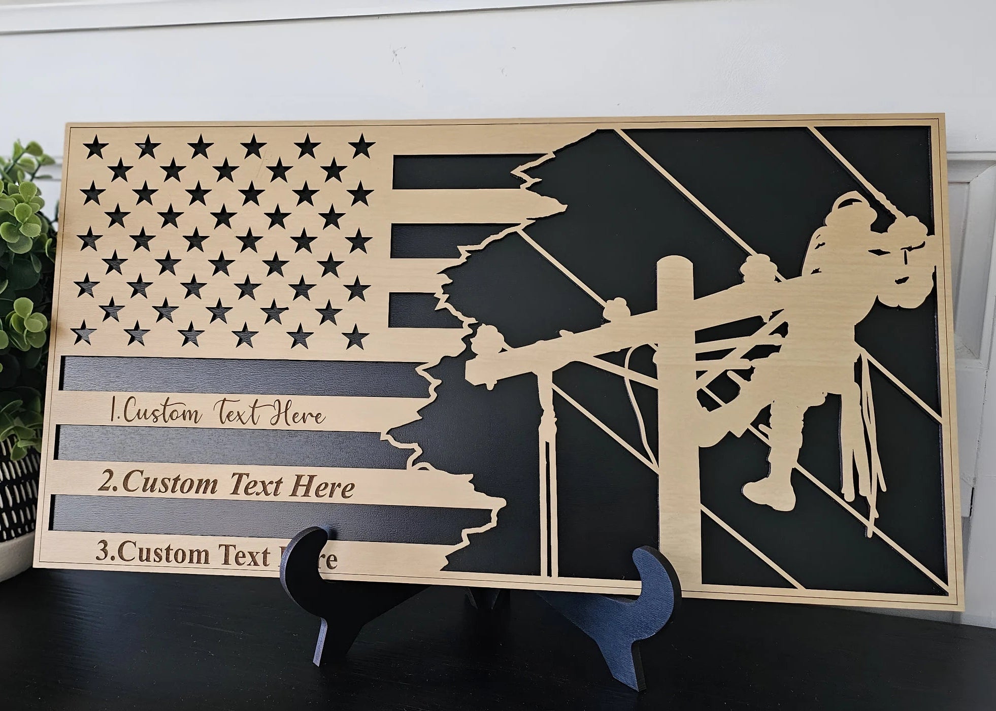 Personalized lineman flag plaque with custom text, wood and black design, displayed on a warm shelf