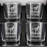 Four personalized lineman whiskey glasses with engraved designs arranged in a gift box