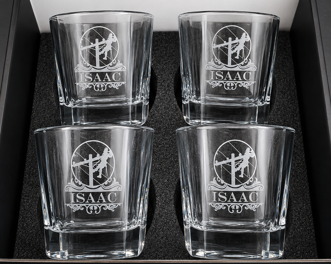 Four personalized lineman whiskey glasses with engraved designs arranged in a gift box