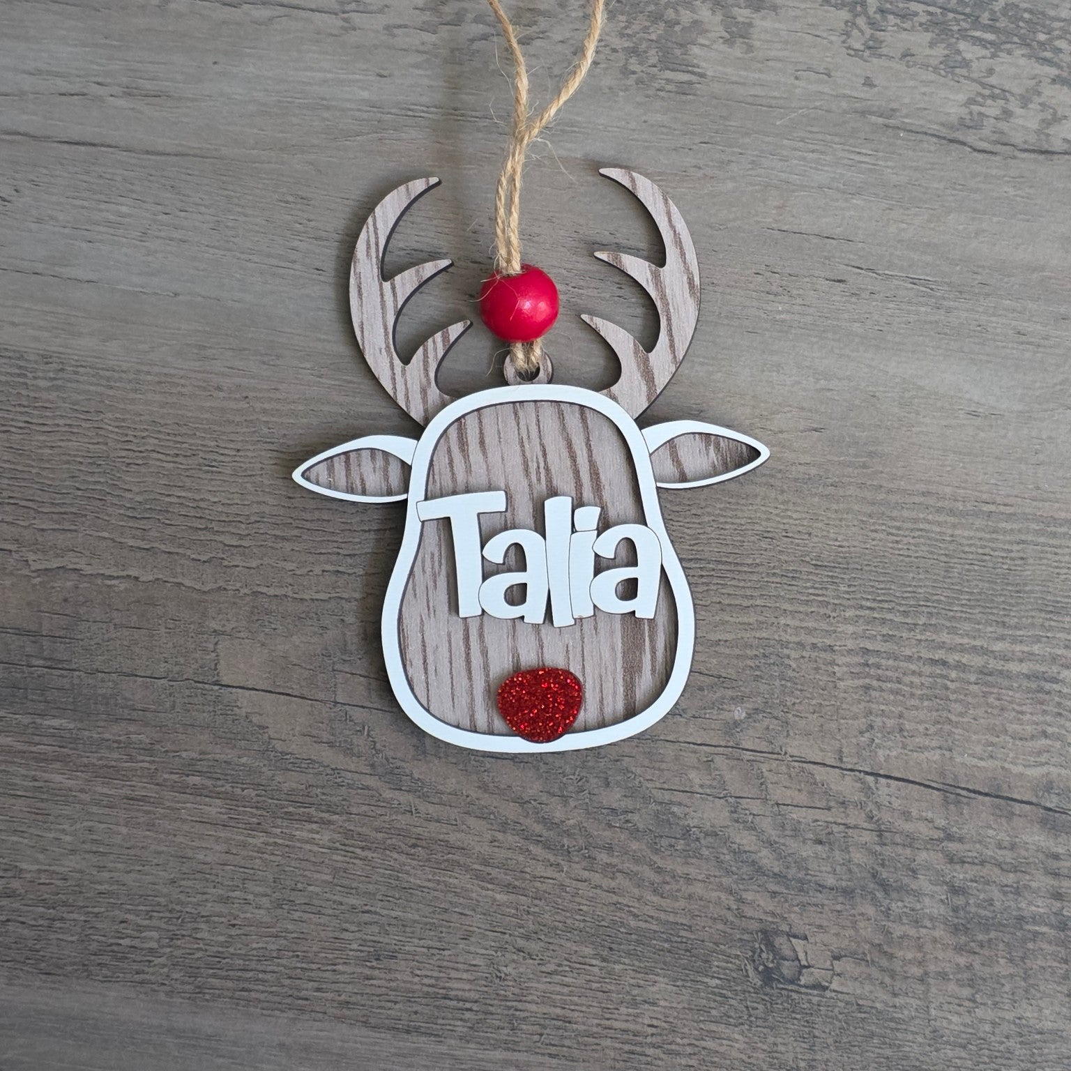 Whitewash personalized reindeer Christmas ornament with white name lettering and red glitter nose