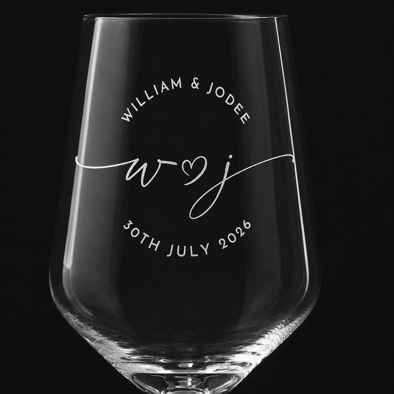 Close-up of permanent engraving with couple names, initials, and wedding date