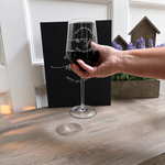 Personalized wine glass held in hand to show its 475 mL size and engraved design