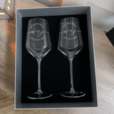 Top view of two personalized wine glasses arranged inside the presentation box