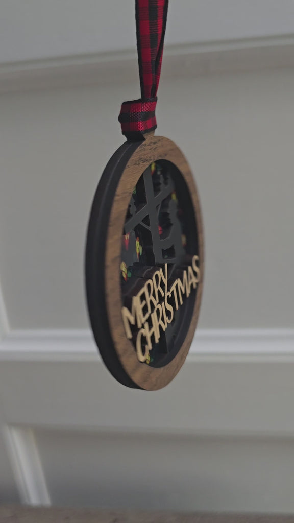 Side view of layered wood lineman Christmas ornament with ribbon hanger