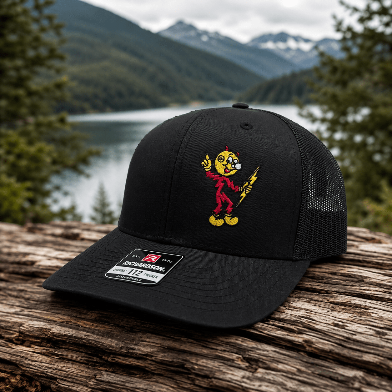 Reddy Kilowatt embroidered Black / Black Richardson 112 trucker hat outdoors