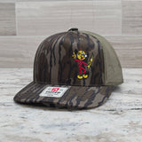 Actual Reddy Kilowatt embroidered Mossy Oak Bottomland and loden Richardson 112P trucker hat