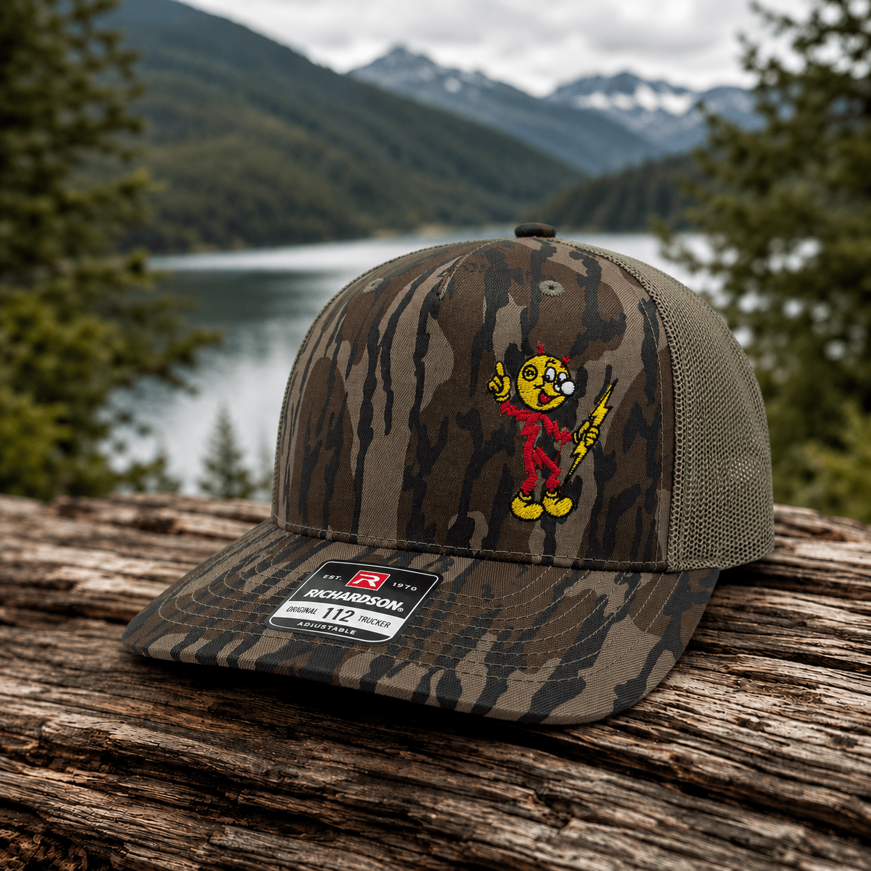 Reddy Kilowatt embroidered Mossy Oak Bottomland and loden Richardson 112P trucker hat outdoors