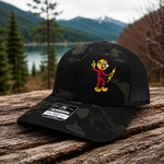 Reddy Kilowatt embroidered Multicam Black / Black Richardson trucker hat outdoors
