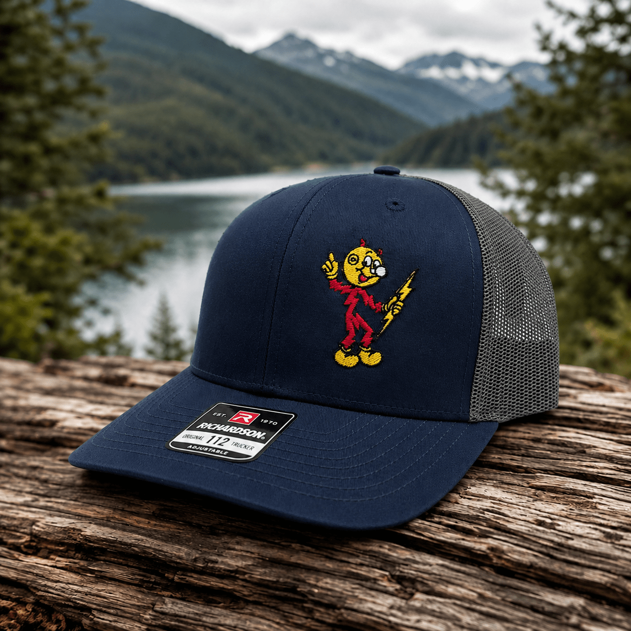 Reddy Kilowatt embroidered Navy / Charcoal Richardson 112 trucker hat outdoors