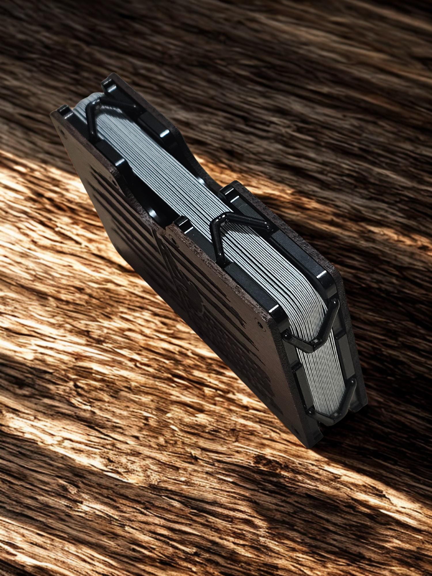 Metallic multitool on a wooden surface